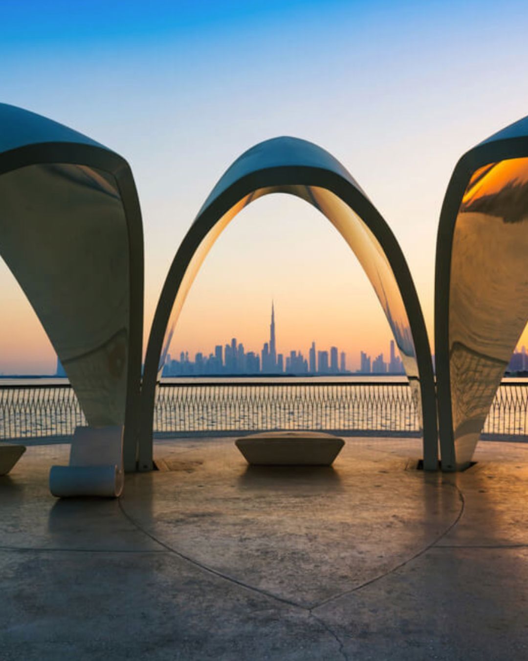 Dubai Creek waterway with traditional boats and modern skyline
